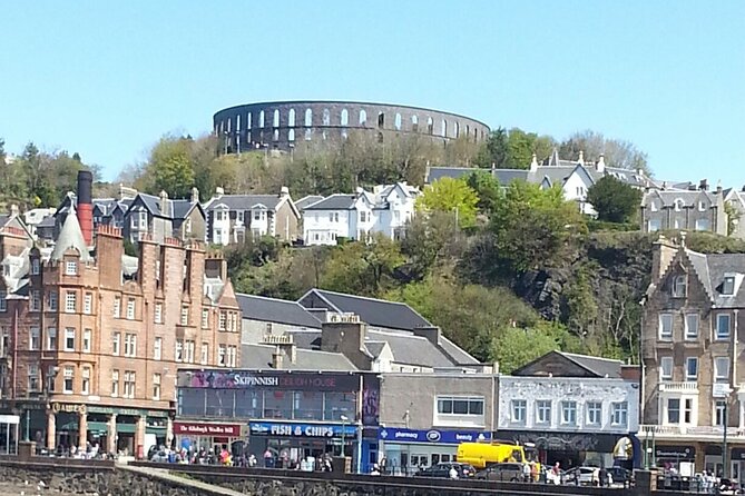 Full-Day Oban Castles and Glencoe Guided Tour from Glasgow - Castle Stalker appears across the water